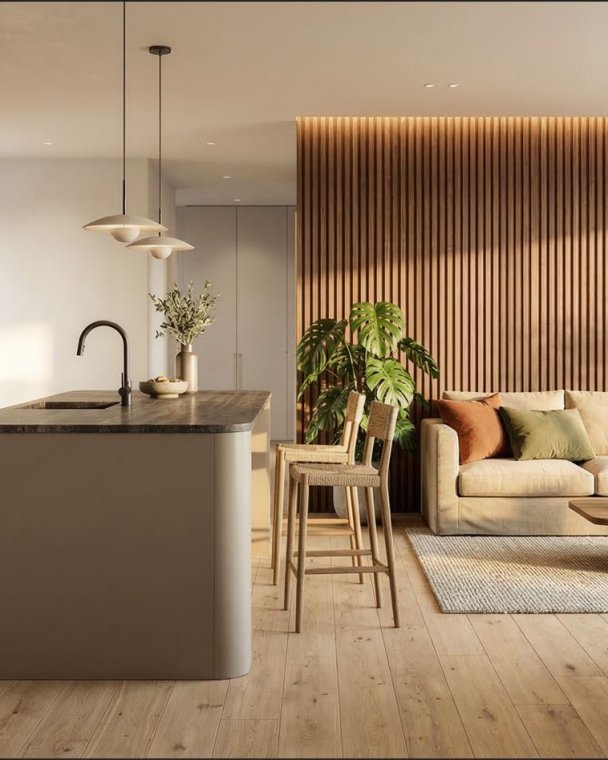 Stue og kjøkken i åpen plan med moderne interiør, trepanel og komfortable møbler, perfekt for boligdesign og visualisering.